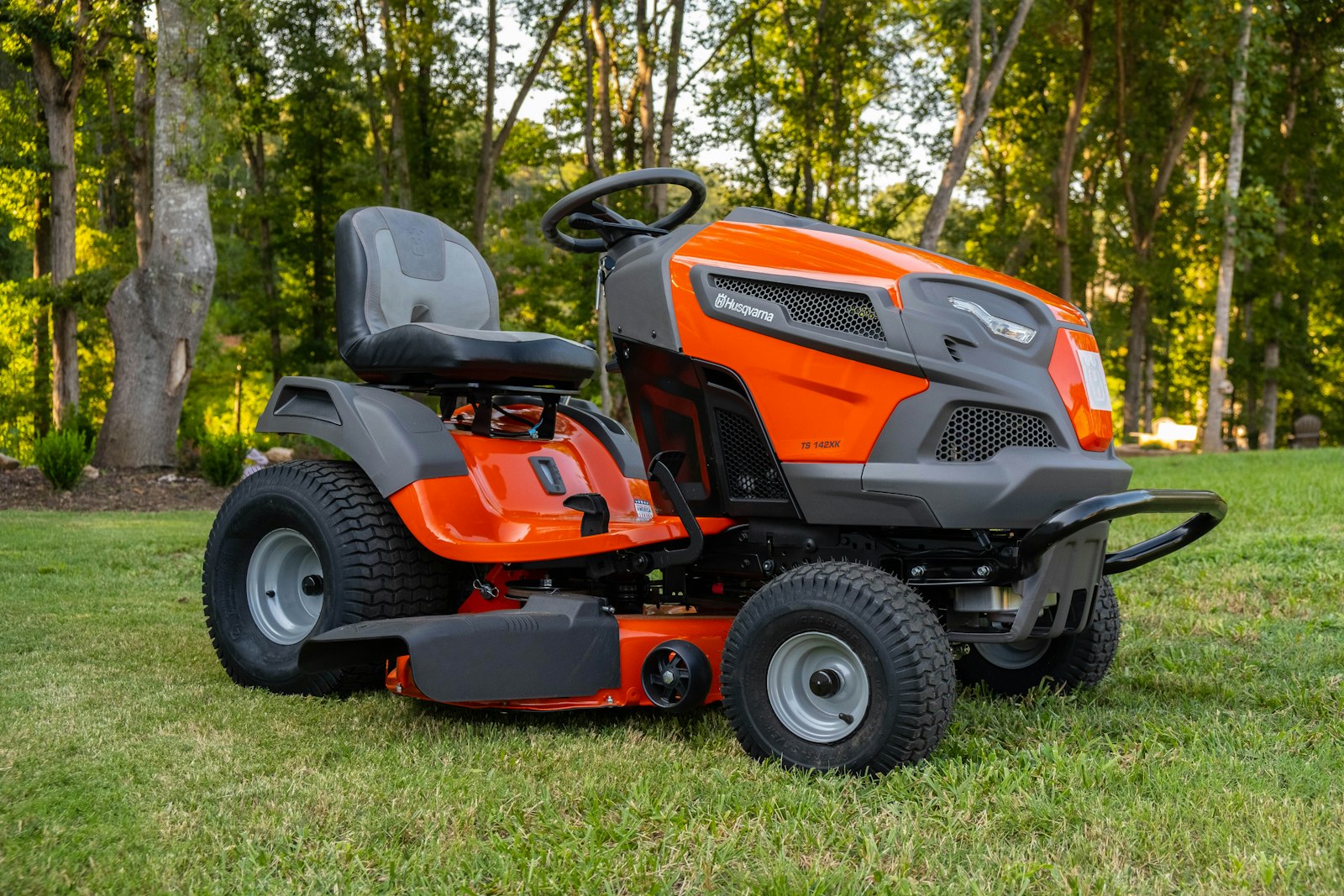 Zero-turn mower mid-cut on a wide Houston-area lawn.
